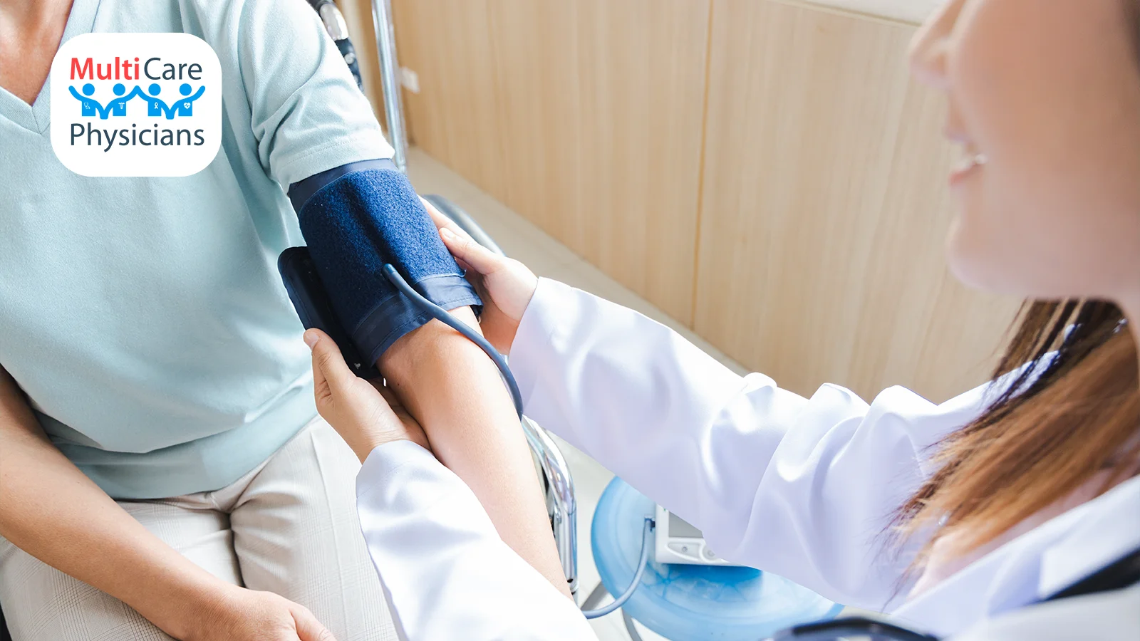 A doctor checks a patient's blood pressure using a sphygmomanometer, ensuring their cardiovascular health is monitored. MultiCare Physicians focuses on personalized care to help individuals keep their blood pressure under control for long-term wellness.